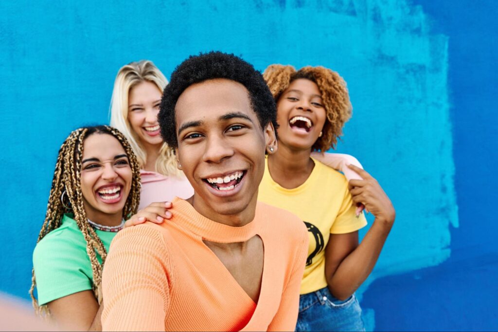 Group of young multi-ethnic friends taking selfie