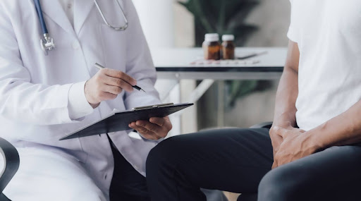 Male Doctor conducting STD testing for a male patient